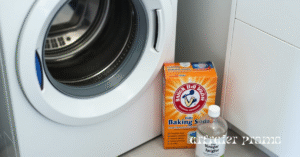 Washing machine drum with baking soda and vinegar ready for cleaning cycle.